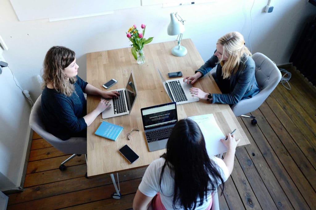 Women at table working