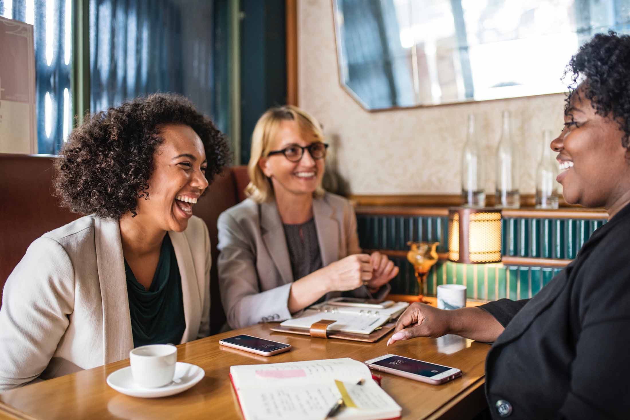 Women in meeting laughing